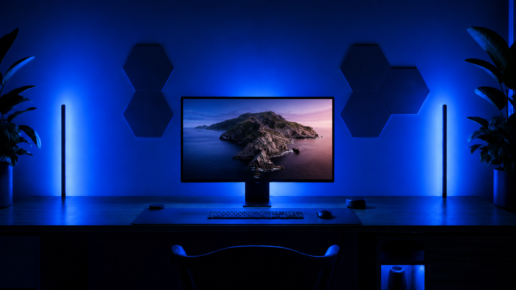 A Catalina coastal wallpaper on a monitor with every ambient light in the room set to one solid blue